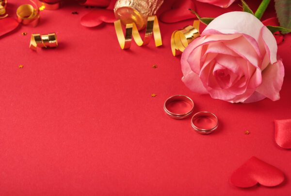 image of rose and wedding rings