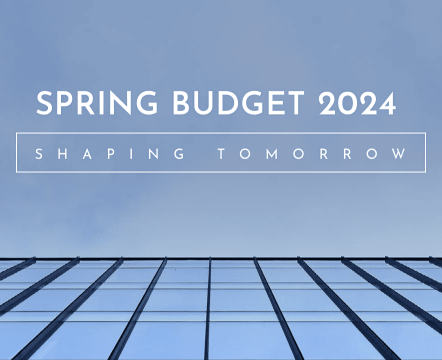 spring budget 2024 image of blue sky reflected in office building